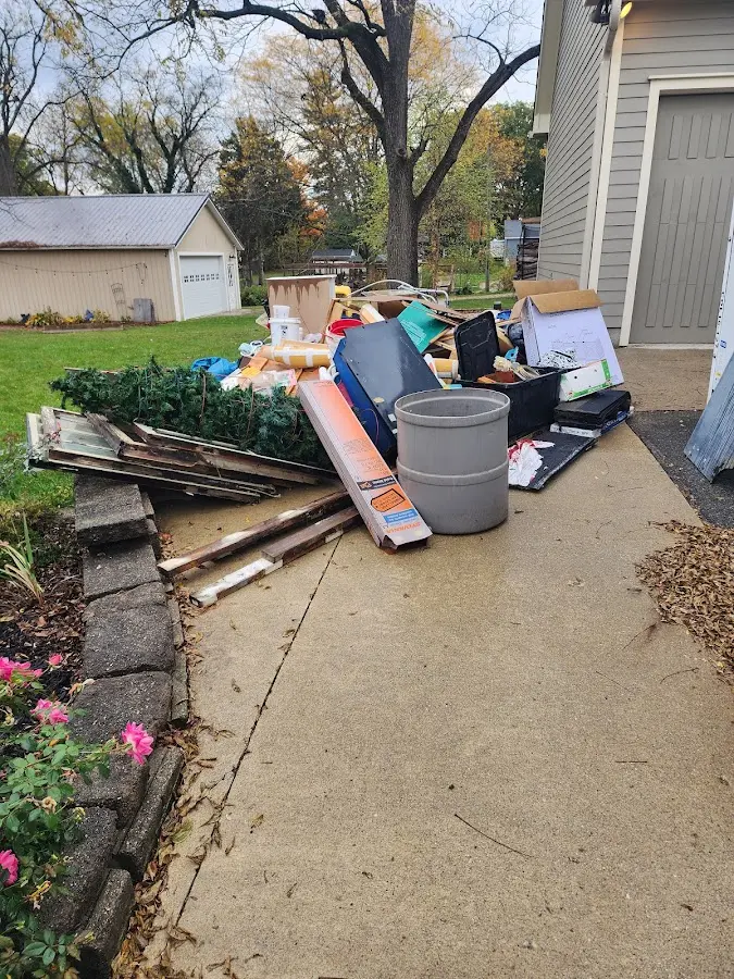 Dumpster being loaded with debris for Residential Dumpster Rental in East Pikeland